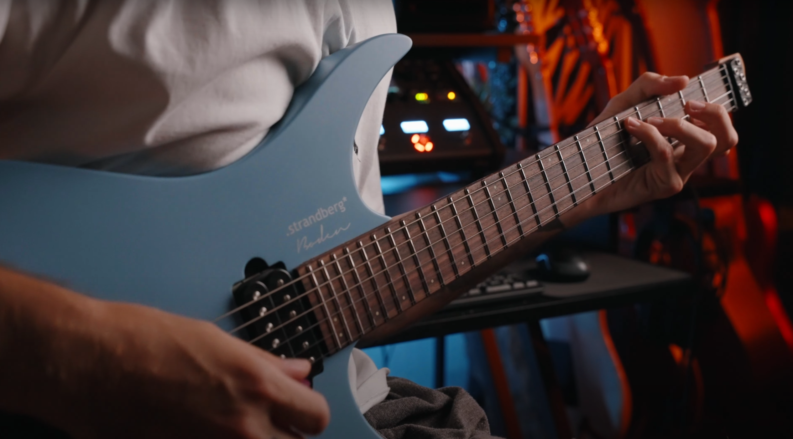 Panda playing a light blue electric guitar